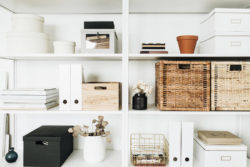 A clean and organised basement with storage boxes