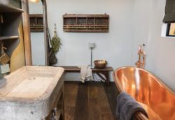 A Stone basin used to achieve a rustic country feel bathroom