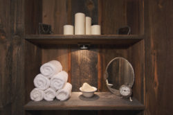 Wooden wall and shelves used to store towels and tissues